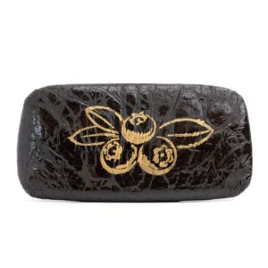 Brick of Blueberry Hash with a stamp of an outline of gold blueberries pressed into the surface, propped up on a clean white background