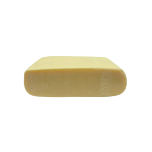 An image of Fruity Cereal OG Hash Rosin cut in half to showcase the inside of the product on a white background
