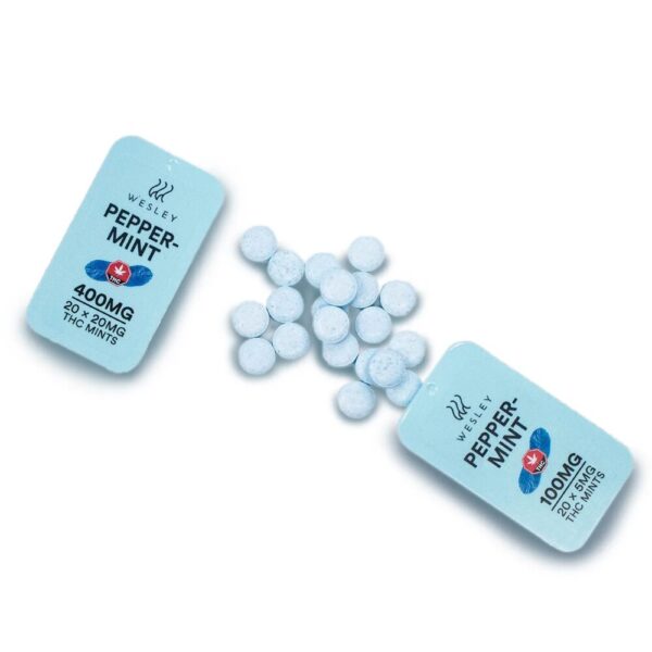 A photo of Wesley – THC Peppermints on a white background, with a few mints spilled out to highlight the product’s look and texture