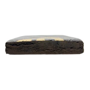An image of Superman Hash cut in half showcasing the inside of the brick on a white background