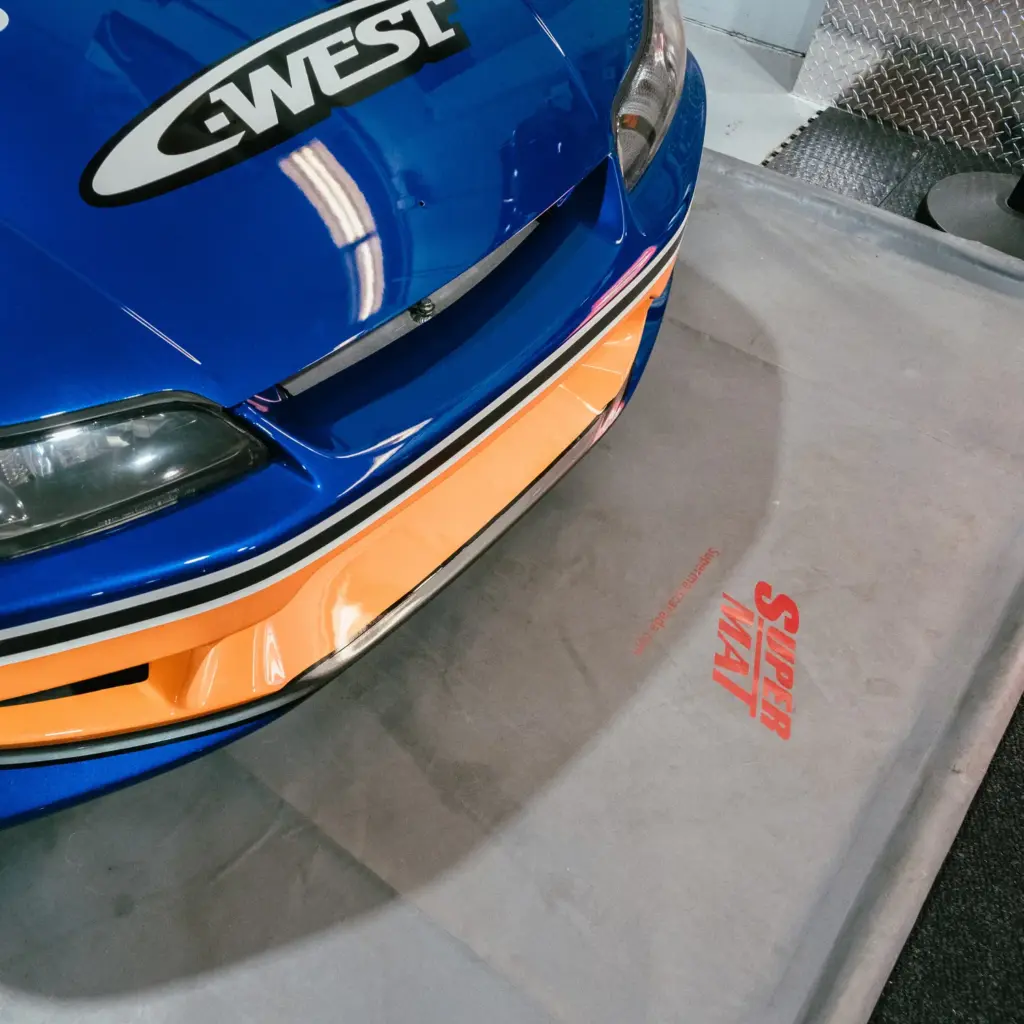 Super Mat garage containment mat in use under a vehicle