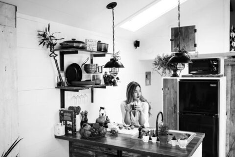 A girl drinking tea in the kitchen